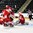 GRAND FORKS, NORTH DAKOTA - APRIL 15: Canada's William Bitten #14 scores a second period goal against Denmark's Kasper Krog #1 while Rasmus Mohr #24 battles with Maxime Comtois #12 during preliminary round action at the 2016 IIHF Ice Hockey U18 World Championship. (Photo by Minas Panagiotakis/HHOF-IIHF Images)

